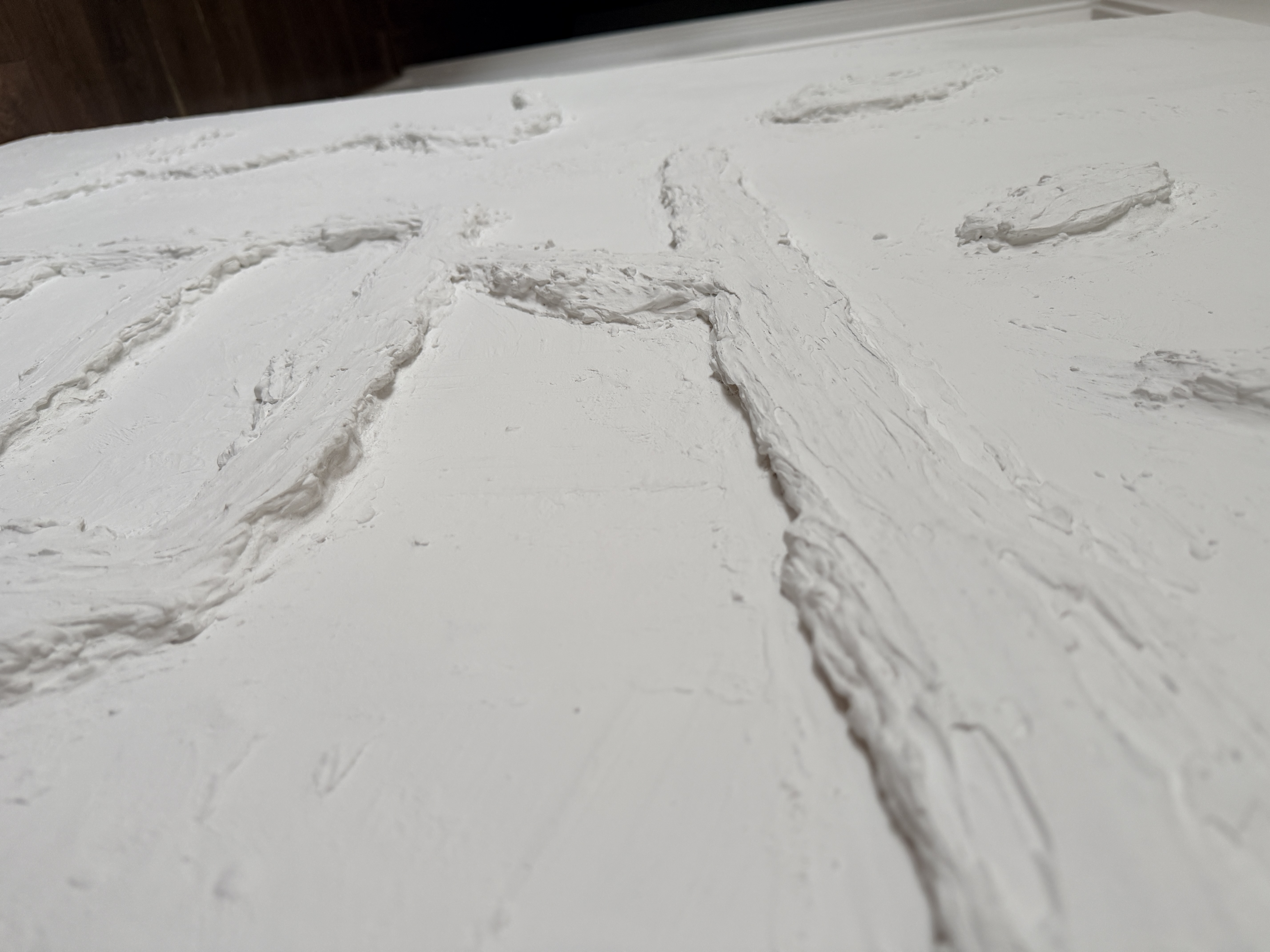 Close-up angled side shot of the Dao visual art piece, highlighting depth and sculptural texture.