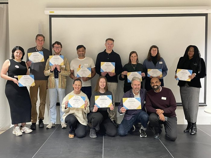 Group photo of the cohort holding their certificates at the London Health Accelerator, hosted by the School for Social Entrepreneurs